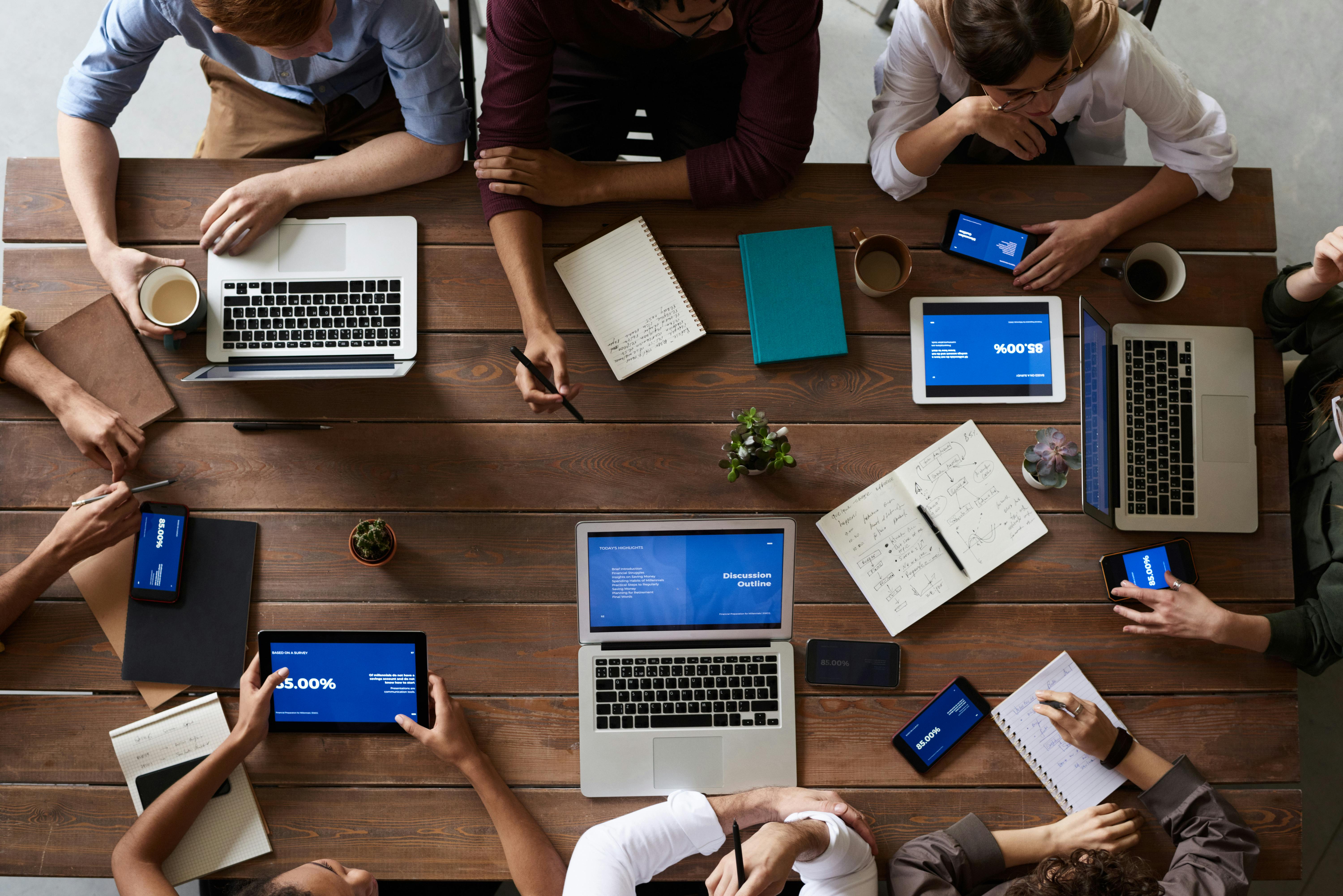 Modern office workspace with laptops and creative business team collaboration